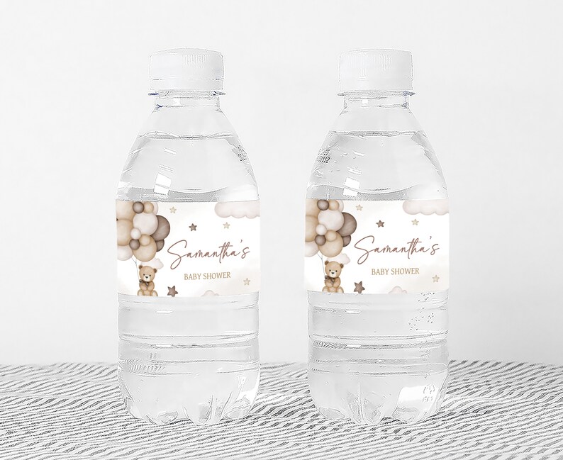 a bottle of water with a teddy bear on it