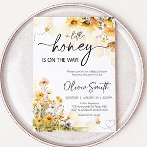 a white plate topped with a card on top of a table