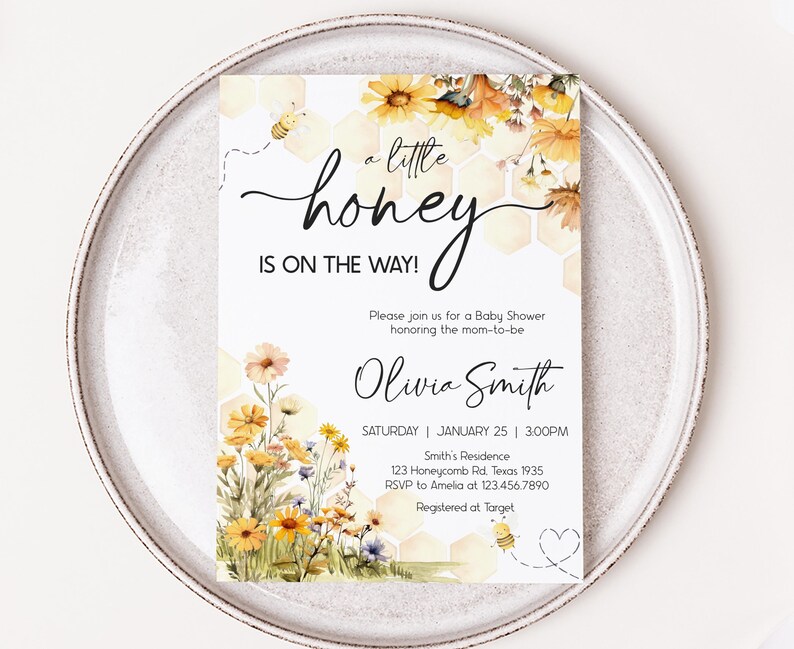 a white plate topped with a card on top of a table