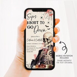 A hand holding a smartphone displaying an invitation for a costume and cocktail party.