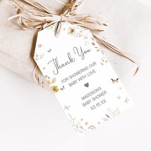 a gift wrapped in brown paper with a tag on it