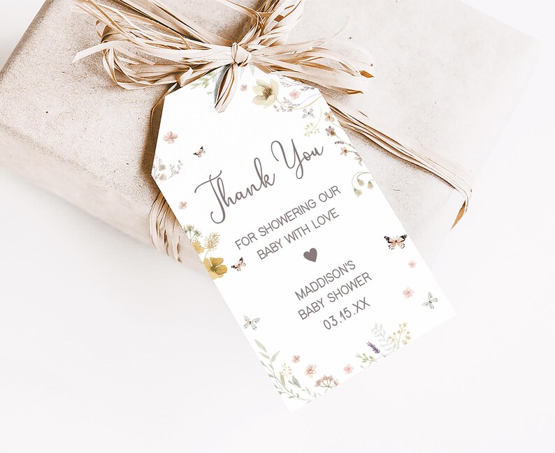 a gift wrapped in brown paper with a tag on it