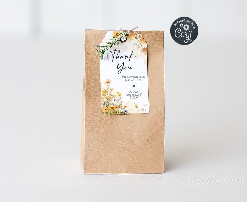 a brown paper bag with a tag that says thank you