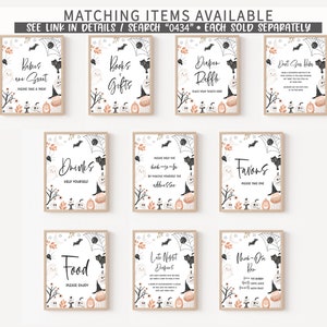 May include: A collection of framed Halloween-themed signs with various messages. Each sign features a white background with black text, pumpkins, ghosts, bats, and spiderwebs. The signs include phrases like "Babies one Gout", "Books & Gifts", and "Drinks Help Yourself".