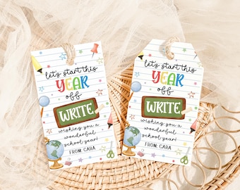 May include: Two white gift tags with a school theme. Each tag has the text "Let's start this YEAR off WRITE" with colorful illustrations of school supplies. The tags are tied with twine.