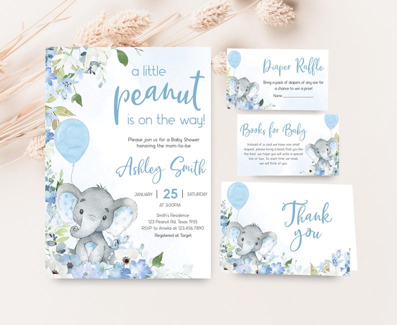 a baby elephant is on the way with a blue balloon