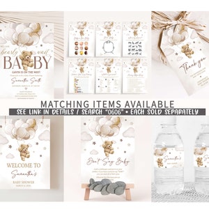 May include: A set of printable baby shower decorations featuring a brown teddy bear holding balloons. The decorations include a welcome sign, a don't say baby sign, water bottle labels, and a thank you tag. The theme is a brown teddy bear with balloons and clouds.