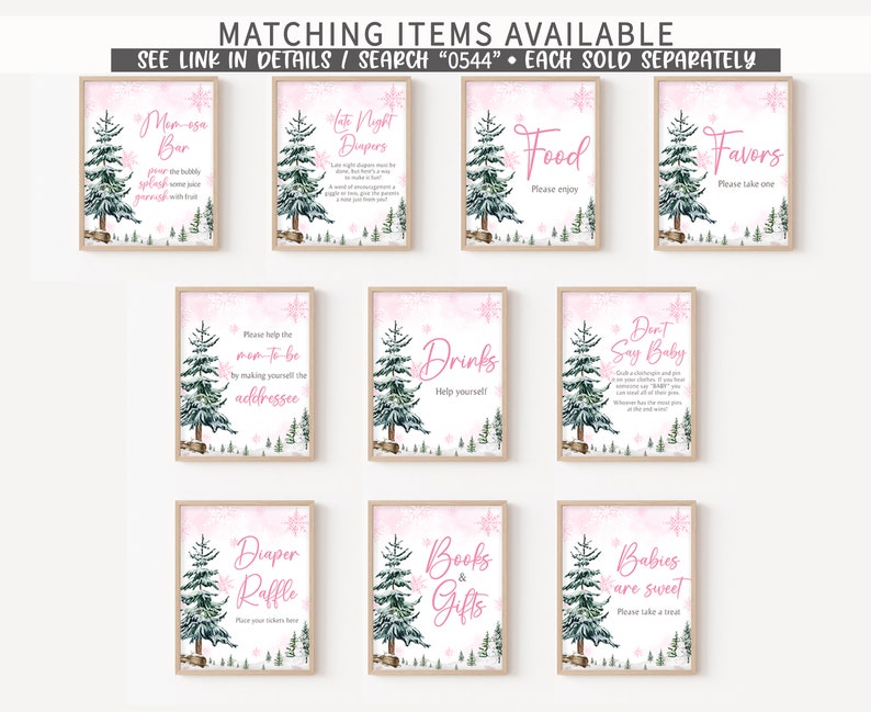 May include: A collection of framed signs with a winter theme. Each sign features a watercolor illustration of a pine tree and snowflakes on a pink background. Text on the signs includes phrases like "Mom-esa Bar" and "Diaper Raffle."