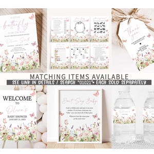 a set of wedding items including a water bottle and a sign