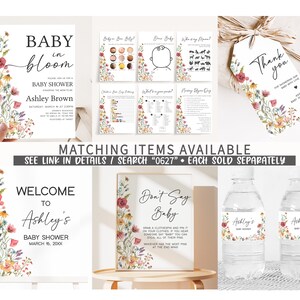 May include: A set of printable baby shower decorations with a floral theme. The set includes a welcome sign, a don't say baby sign, a thank you tag, and water bottle labels. The decorations feature a watercolor floral design with pink, yellow, and green flowers.