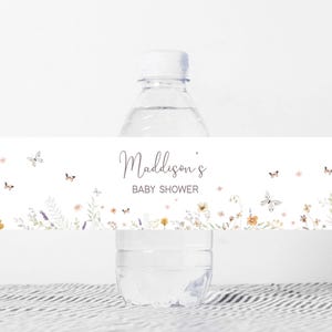 a bottle of water with a name tag on it