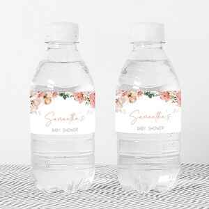 a bottle of water with a label for a baby shower