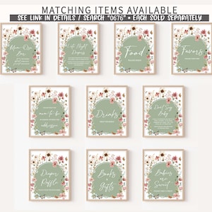 May include: Set of ten printable signs for a baby shower. The signs feature a floral design with butterflies and green and pink colors. The signs include titles such as "Mom-to-be", "Drinks", "Don't Say Baby", "Diaper Raffle", "Books & Gifts", and "Babies are Sweet".