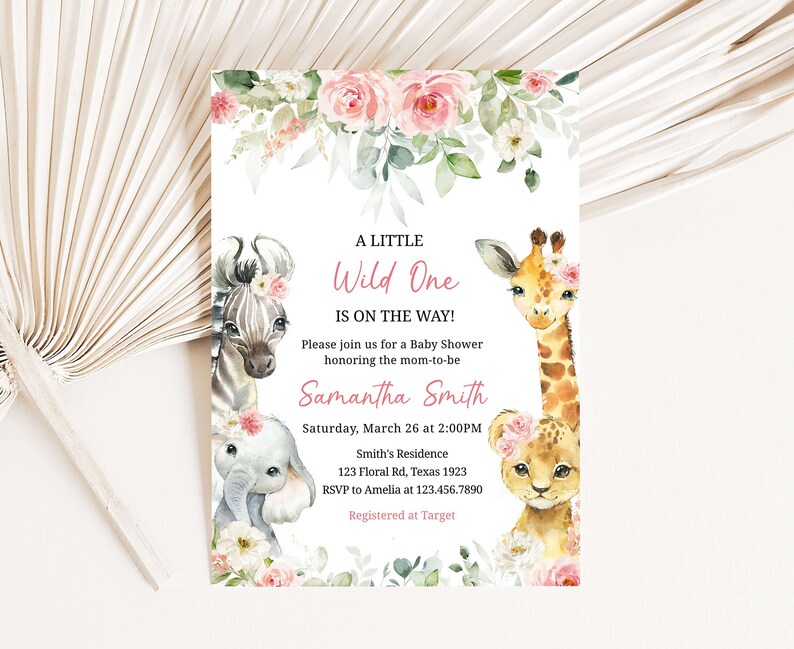 May include: A baby shower invitation with a pink floral border and illustrations of a zebra, giraffe, elephant, and lion. The text reads "A Little Wild One Is On The Way!" and includes the name "Samantha Smith", the date and time of the shower, the location, and RSVP information.
