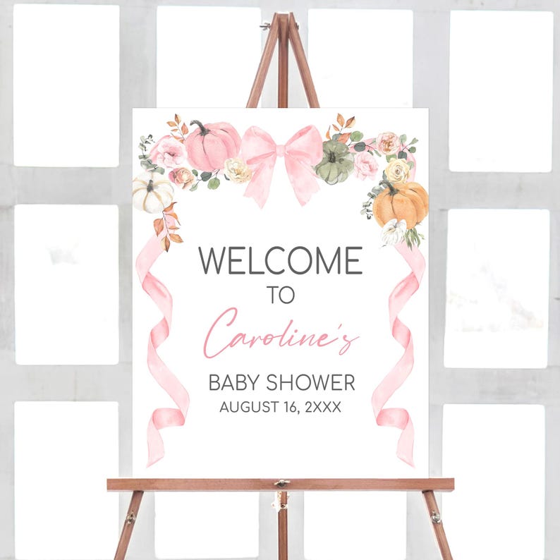 a welcome sign for a baby shower on a easel