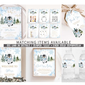 May include: A collection of baby shower stationery with a winter theme. Includes invitations, games, a welcome sign, and water bottle labels. Each item features a penguin in a scarf, snowflakes, and the text "Baby It's Cold Outside."