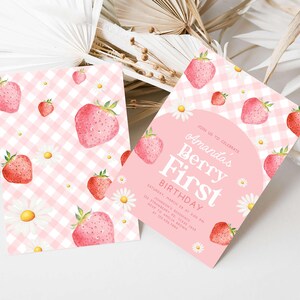 a pink and white checkered paper with strawberries on it