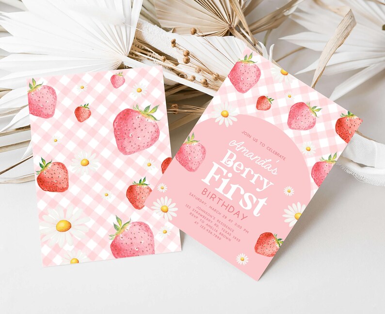 a pink and white checkered paper with strawberries on it