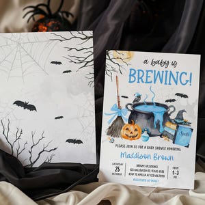 A Halloween-themed baby shower invitation featuring bats, a cauldron, and a pumpkin, with the text "a baby is BREWING!"
