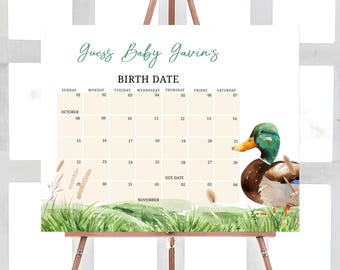Könnte beinhalten: Ein druckbares Babyparty-Spielschild mit einem Kalender, auf dem die Gäste das Geburtsdatum des Babys erraten können. Der Kalender ist für Oktober und November. Das Schild zeigt eine Aquarell-Illustration eines Entchens in einem grasbewachsenen Feld.