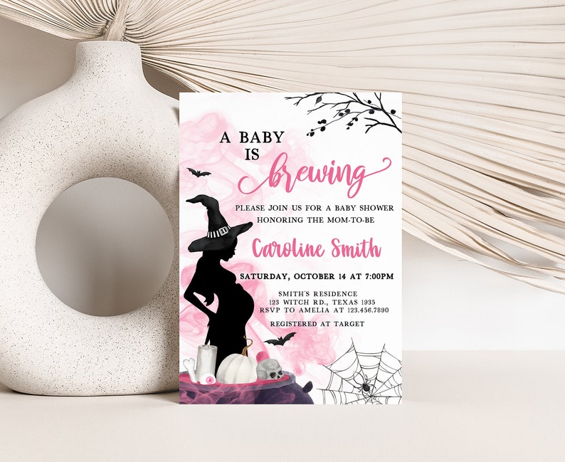 May include: A baby shower invitation with a Halloween theme. The invitation features a silhouette of a pregnant woman wearing a witch hat, with pink and black accents. Text includes "A Baby is Brewing" and event details.