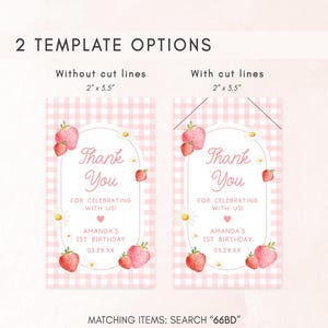 a pair of tags with strawberries on them
