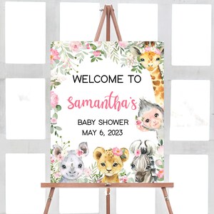 May include: Welcome to Samantha's Baby Shower on May 6, 2023. A pink and green floral welcome sign with a giraffe, monkey, rhino, lion, and zebra.