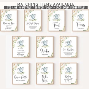 May include: Set of ten printable baby shower signs featuring a cute gray elephant with white flowers. The signs include titles like "M-Bar", "Late Night Dampers", "Food", "Favors", "Drinks", "Don't Say Baby", "Diaper Raffle", "Books & Gifts", and "Babies are Sweet".