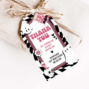 a thank you tag attached to a wrapped present