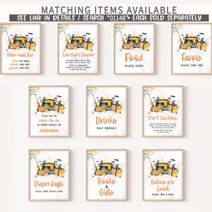 a collection of nine framed items, each with a different design and text, arranged in a grid. The items include a poster with a pumpkin, a poster with a truck, a poster with a book, a poster with a baby, a poster with a drink, a poster with a book, a poster with a gift, and a poster with a diaper rattle. The text on the posters varies, but they all seem to be related to baby-related items or activities.