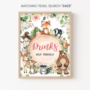 May include: A printable sign with a woodland theme. The sign features a variety of animals including a fox, a raccoon, a deer, a bear, a squirrel, and an owl. The sign says "Drinks Help Yourself" in pink lettering.