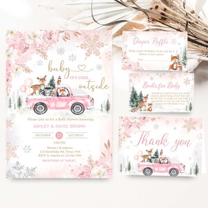 May include: A collection of baby shower stationery with a winter theme. The main invitation shows a pink truck with woodland creatures and the phrase "baby it's cold outside." Other cards include "Diaper Raffle," "Books for Baby," and a thank you card.