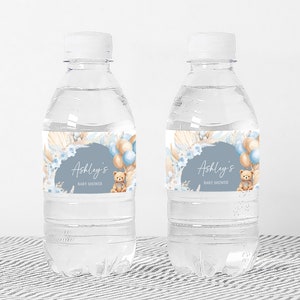 a bottle of water with a teddy bear on it