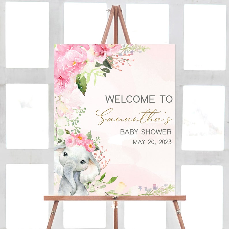 May include: Pink and green floral baby shower welcome sign with a watercolor illustration of a baby elephant wearing a flower crown. The sign says "Welcome to Samantha's Baby Shower May 20, 2023".