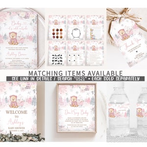 May include: A collection of baby shower stationery with a winter theme. Includes invitations, games, thank you tags, a welcome sign, and water bottle labels. The designs feature a teddy bear, snowflakes, and a soft pink and gray color palette. Text includes "Baby it's cold outside" and "Welcome to Ashley's Baby Shower".