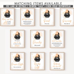 May include: A collection of framed signs with a Halloween theme. Each sign features a black cauldron with orange steam and a raven. Text on the signs includes "Mom-osa Bar", "Food", "Favors", "Drinks", and "Diaper Raffle".