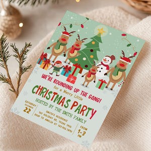 a christmas party with a card on a blanket