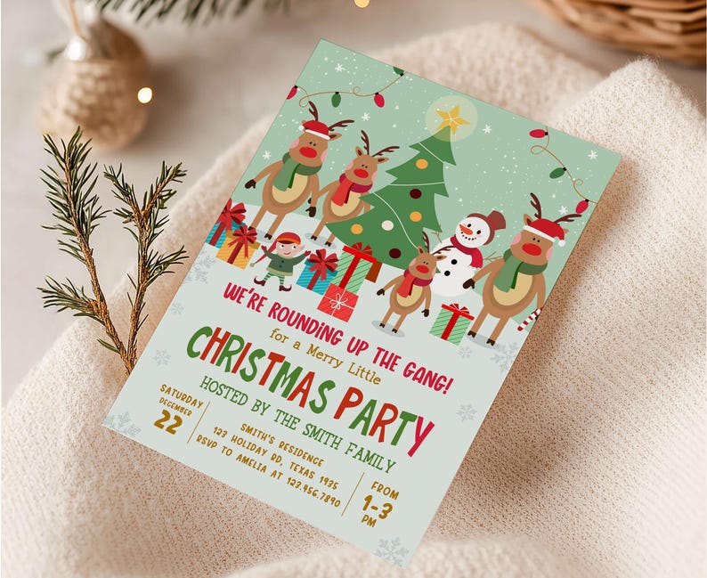 a christmas party with a card on a blanket