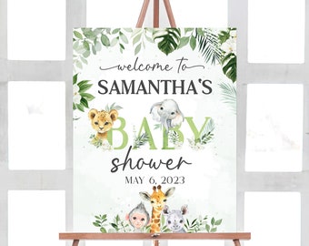 May include: Welcome to Samantha's Baby Shower sign with a green and white jungle theme. The sign features a lion, elephant, giraffe, monkey, and rhinoceros. The date of the shower is May 6, 2023.