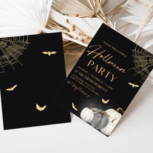 a black and gold halloween party with pumpkins and bats