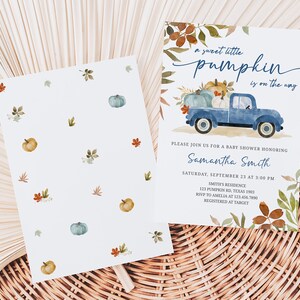 May include: Baby shower invitation with a watercolor design. The invitation features a blue truck carrying pumpkins, with the text "a sweet little pumpkin is on the way." The back of the invitation has a pattern of pumpkins and leaves.