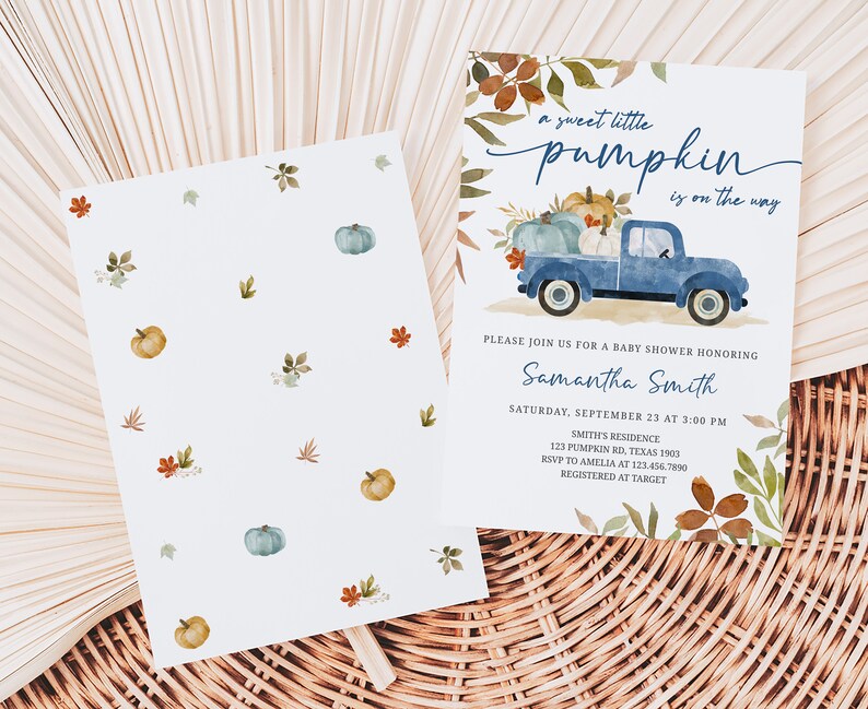 May include: Baby shower invitation with a watercolor design. The invitation features a blue truck carrying pumpkins, with the text "a sweet little pumpkin is on the way." The back of the invitation has a pattern of pumpkins and leaves.