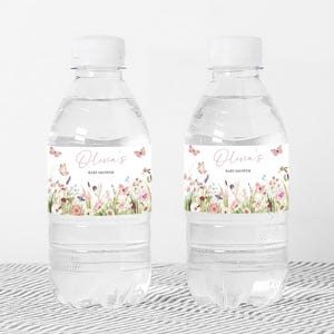 two bottles of water sitting on a table