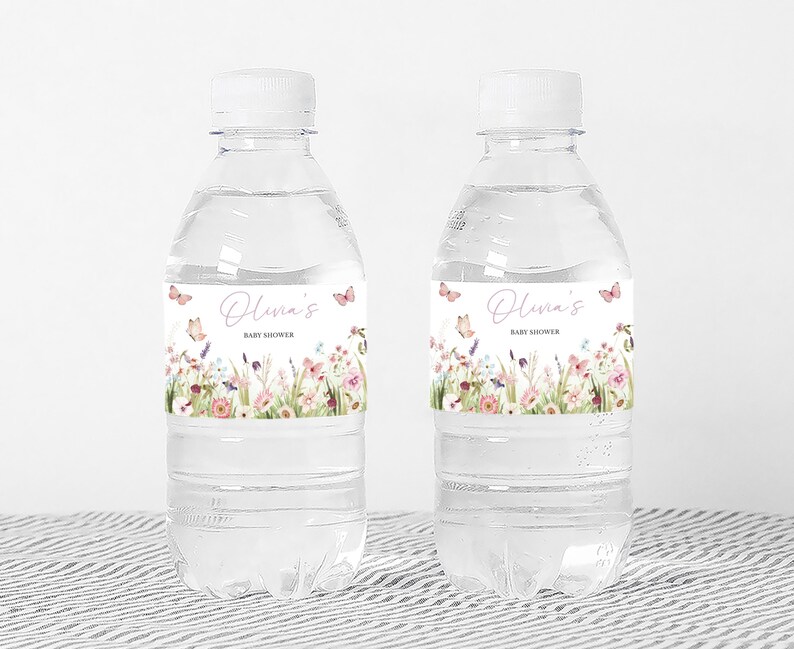 two bottles of water sitting on a table