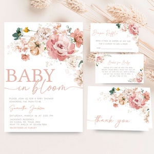 a baby in bloom baby shower with pink flowers and greenery