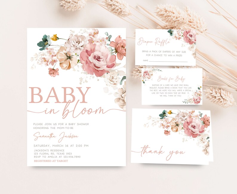 a baby in bloom baby shower with pink flowers and greenery