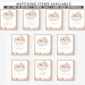 May include: A collection of framed signs with floral pumpkin designs. The signs have gold text and are for a baby shower. Text includes "Mimosa Bar", "Late Night Diapers", "Food", "Favors", "Drinks", and "Books & Gifts".