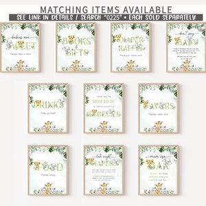 May include: A set of ten printable signs for a jungle-themed baby shower. The signs feature a variety of jungle animals, including monkeys, elephants, and giraffes. The signs are decorated with green leaves and have a watercolor effect. The signs include text such as "Babies are Sweet", "Books & Gifts", "Diaper Raffle", "Don't Say Baby", "Drinks", "Mom-to-Be Dresser", "Favors", "Food", "Late Night Diapers", and "Mom-isa Bar".