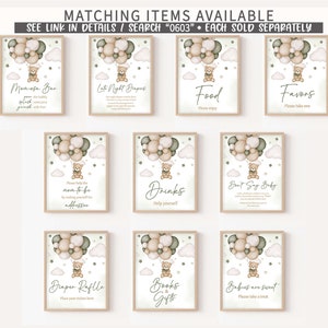 May include: Nine printable signs for a baby shower with a woodland theme. Each sign features a cute cartoon bear holding balloons and a cloud background. The signs include: "Momega Bar", "Late Night Diapers", "Food", "Favors", "Please help the mom-to-be by making yourself the addressee", "Drinks", "Don't Say Baby", "Diaper Raffle", "Books & Gifts", and "Babies are sweet".