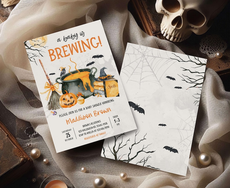 A Halloween-themed invitation for a baby shower, featuring a pot of bubbling soup, a jack-o-lantern, and bats, along with details about the event.
